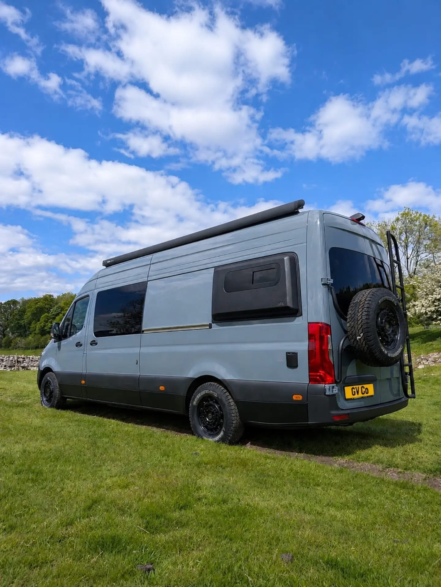 Rear three-quarter view against blue sky